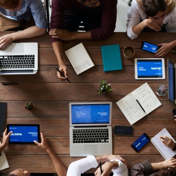 business meeting with laptops on a table